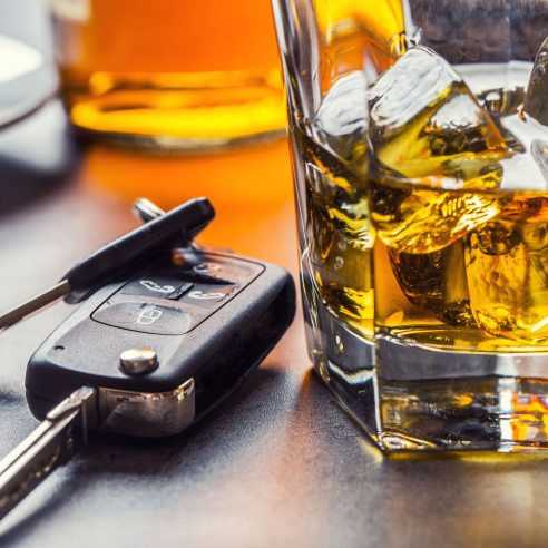 car keys and cocktail on table